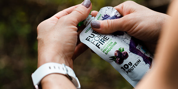 Closeup of woman's hands opening a Fuel for Fire pouch